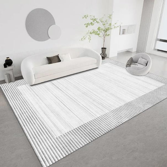 Salon avec tapis blanc et gris